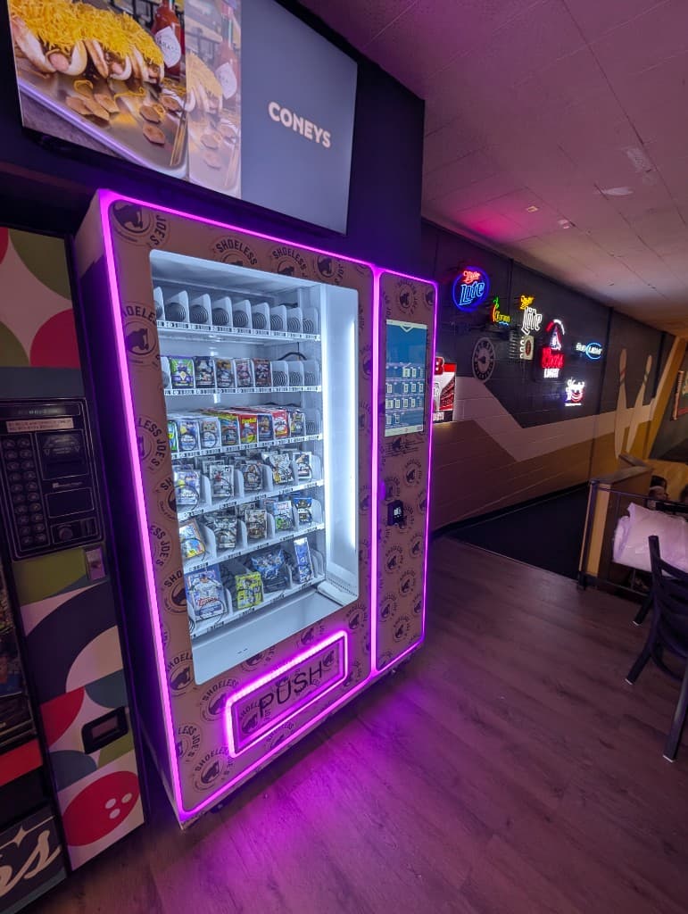 Shoeless Joe's sports cards and pokemon vending machine